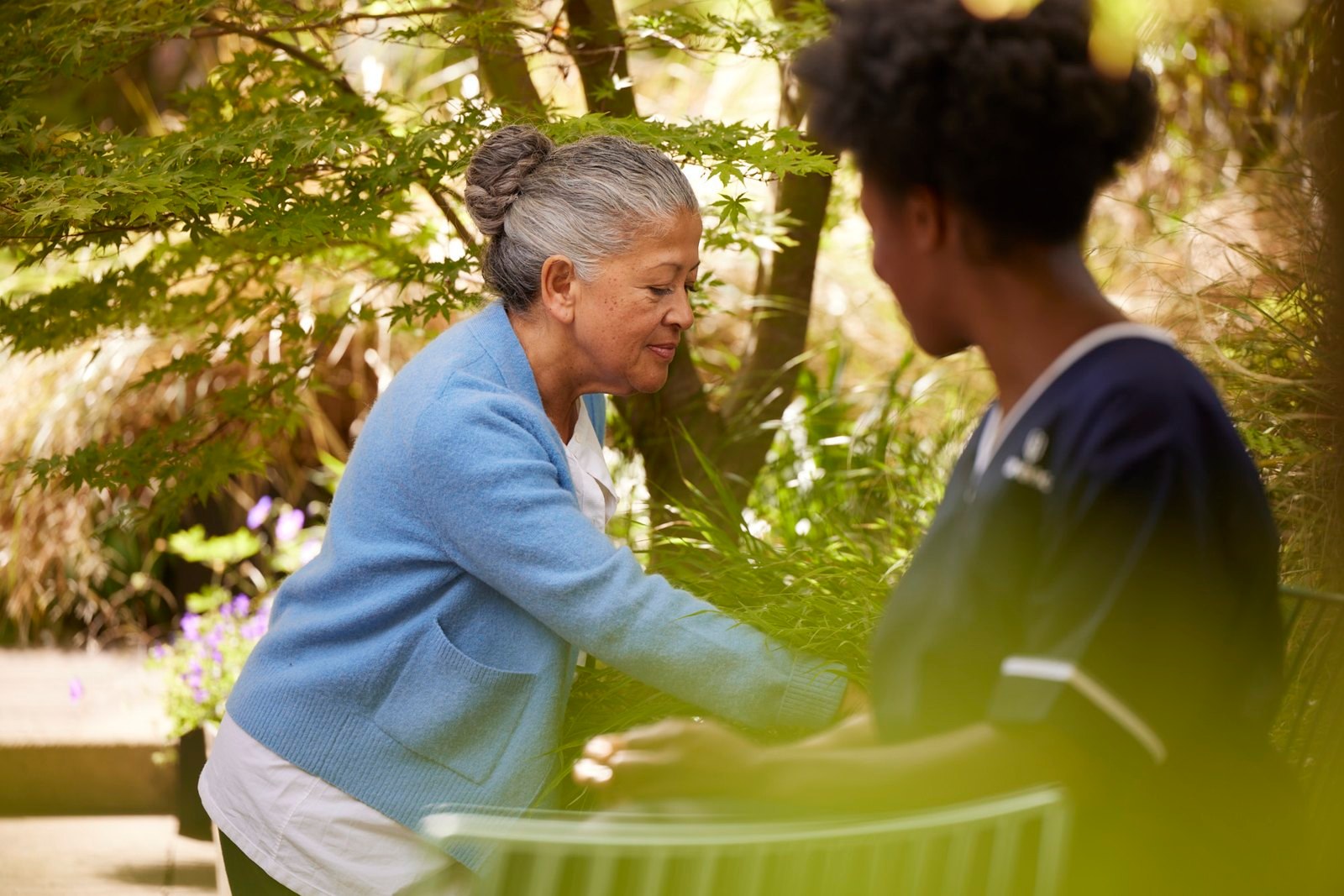 Florence: a nurse and an older woman sitting together in a garden
