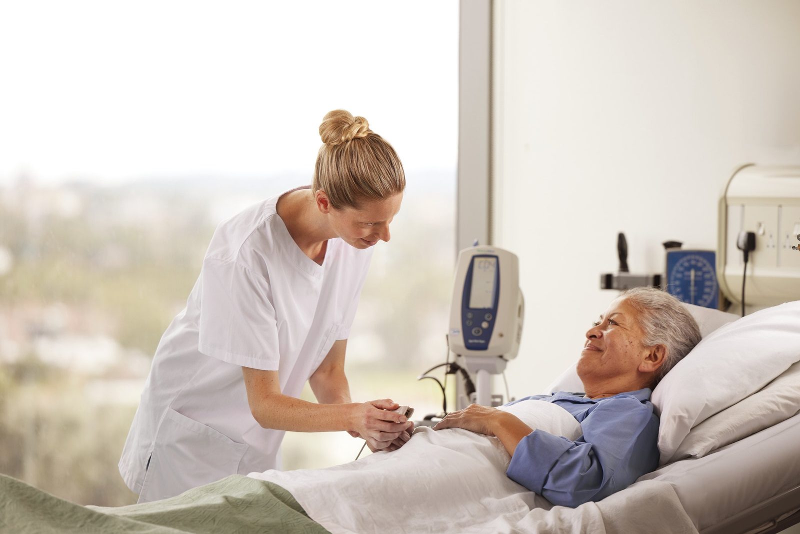 Florence nurse caring for a patient on a hospital ward